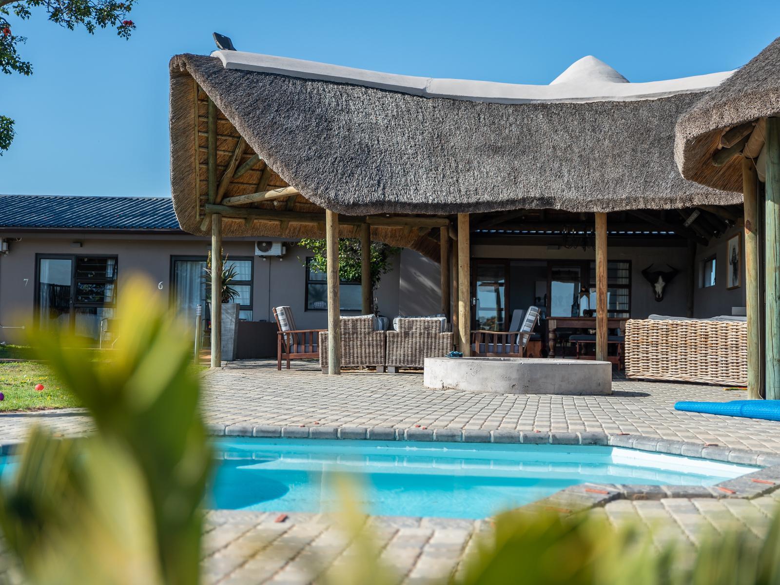 Blue Crane Lodge pool and thatched lapa at Longhill Reserve
