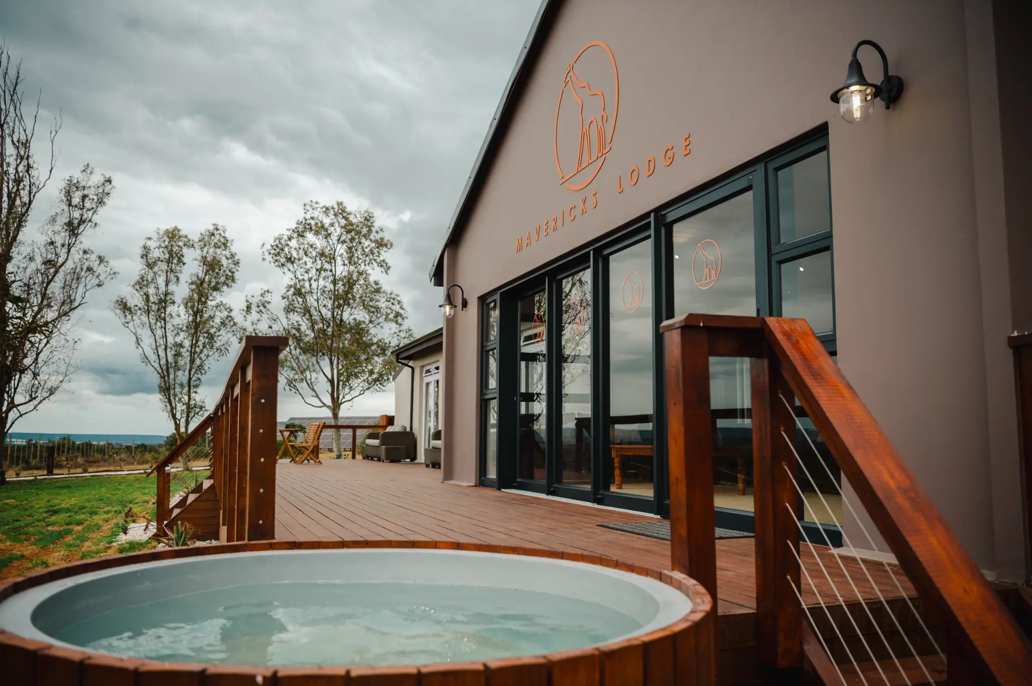Mavericks Lodge exterior deck and private hot tub at Longhill Reserve